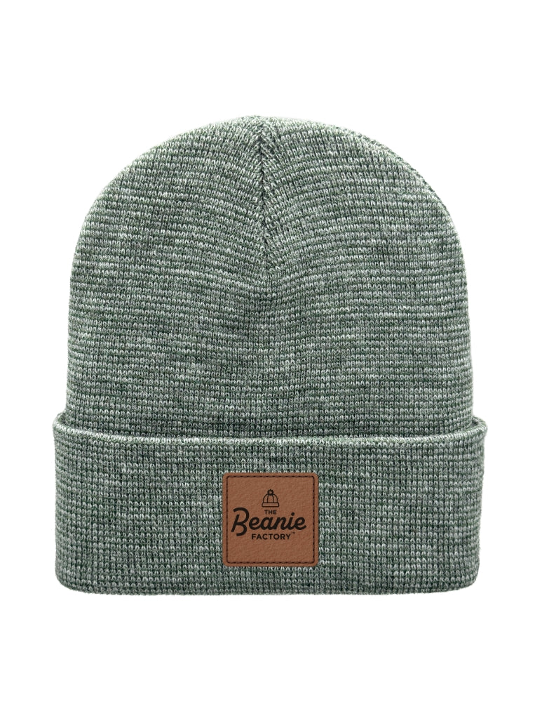 Green beanie with a brown leather patch on a white background