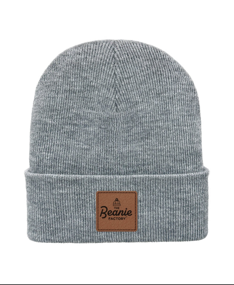 Gray beanie with a brown leather patch on a white background